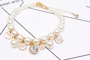 Designer Necklace with Pearls Charms and Blings